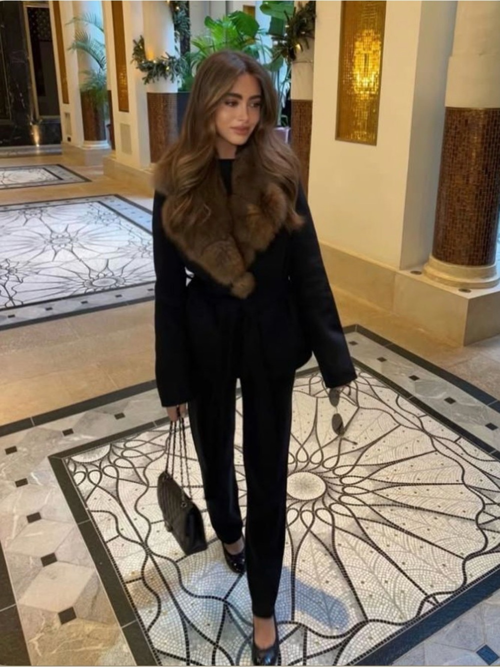 brown mid-century fur stole with decorative pom-poms.